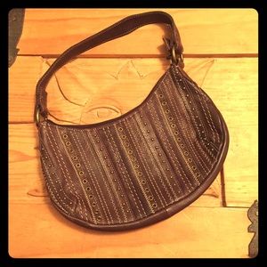 Shoulder or hand purse by Fossil.
